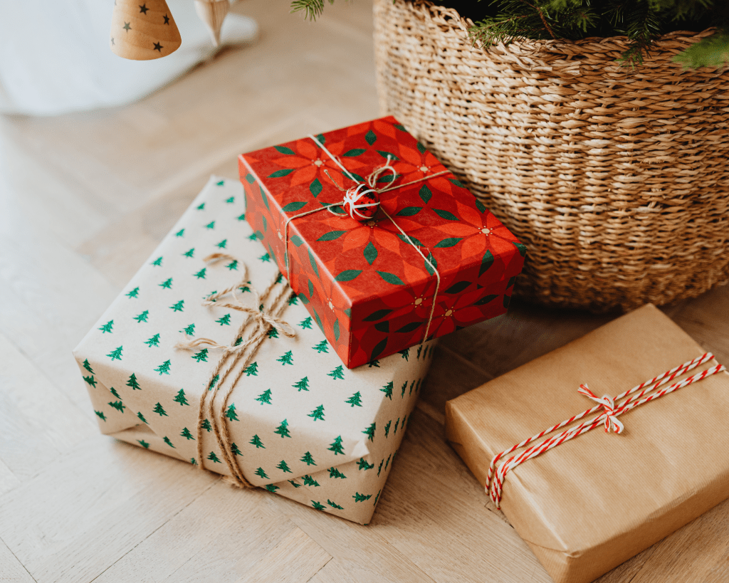 Gift guide presents under a Christmas tree