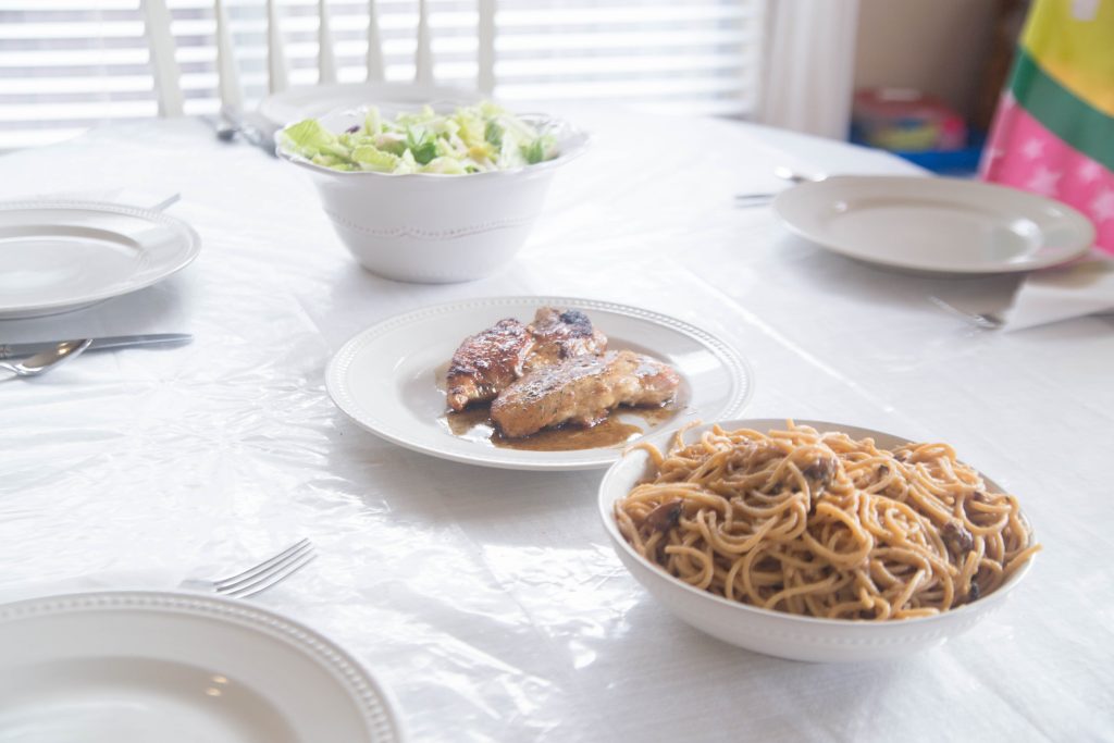 Dinner dishes on a table with recipes made using Raddish Kids recipe cards